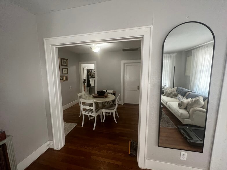 Dining area sits at the center of the home, with access to the bedroom and kitchen - 1220 Waugh Dr