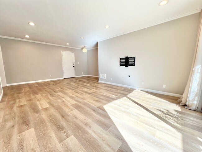 Building Photo - Contemporary 2 Bed Condo with 2 Garage Parking Spaces, Community Pool, and 3 Private Balconies