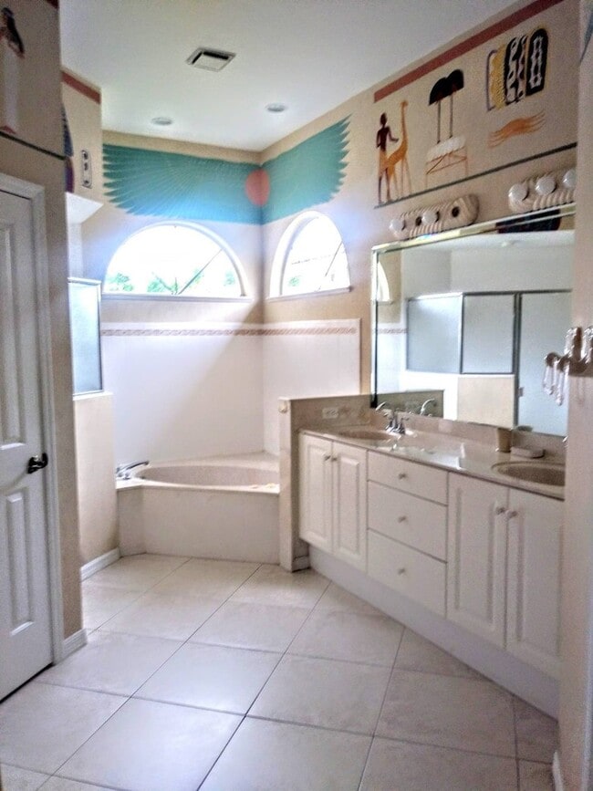 Building Photo - ENJOY LIFE IN THIS 4 BEDROOM UNIQUE LAKE V...