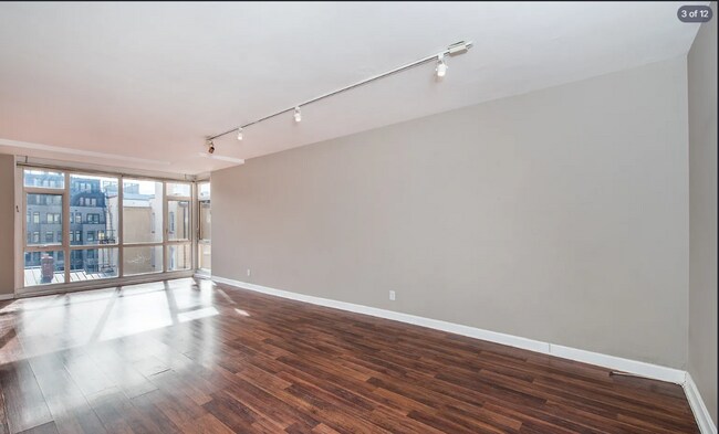 Building Photo - Bright fifth-floor one-bedroom in the heart of Dupont Circle with floor-to-ceiling windows and an...