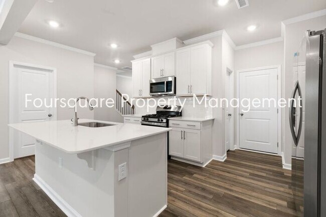 Building Photo - Coming Soon; July 27, 2026 : End unit ToSpacious End-Unit Townhome with 2nd Floor Loft, Screened-...