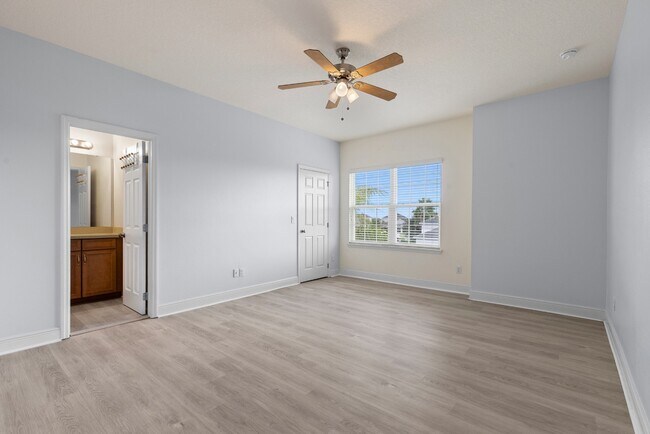 Building Photo - Spacious 6-Bedroom Home Near Lake Nona | 3-Car Garage + Tesla Charger
