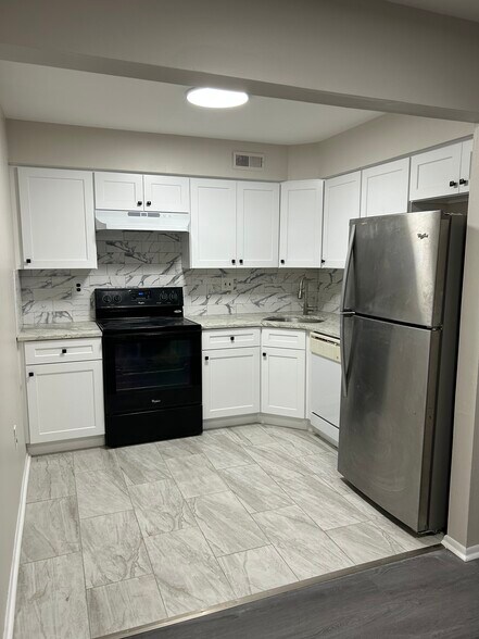 Kitchen, brand new cabinets and floor - 124 Willow Turn