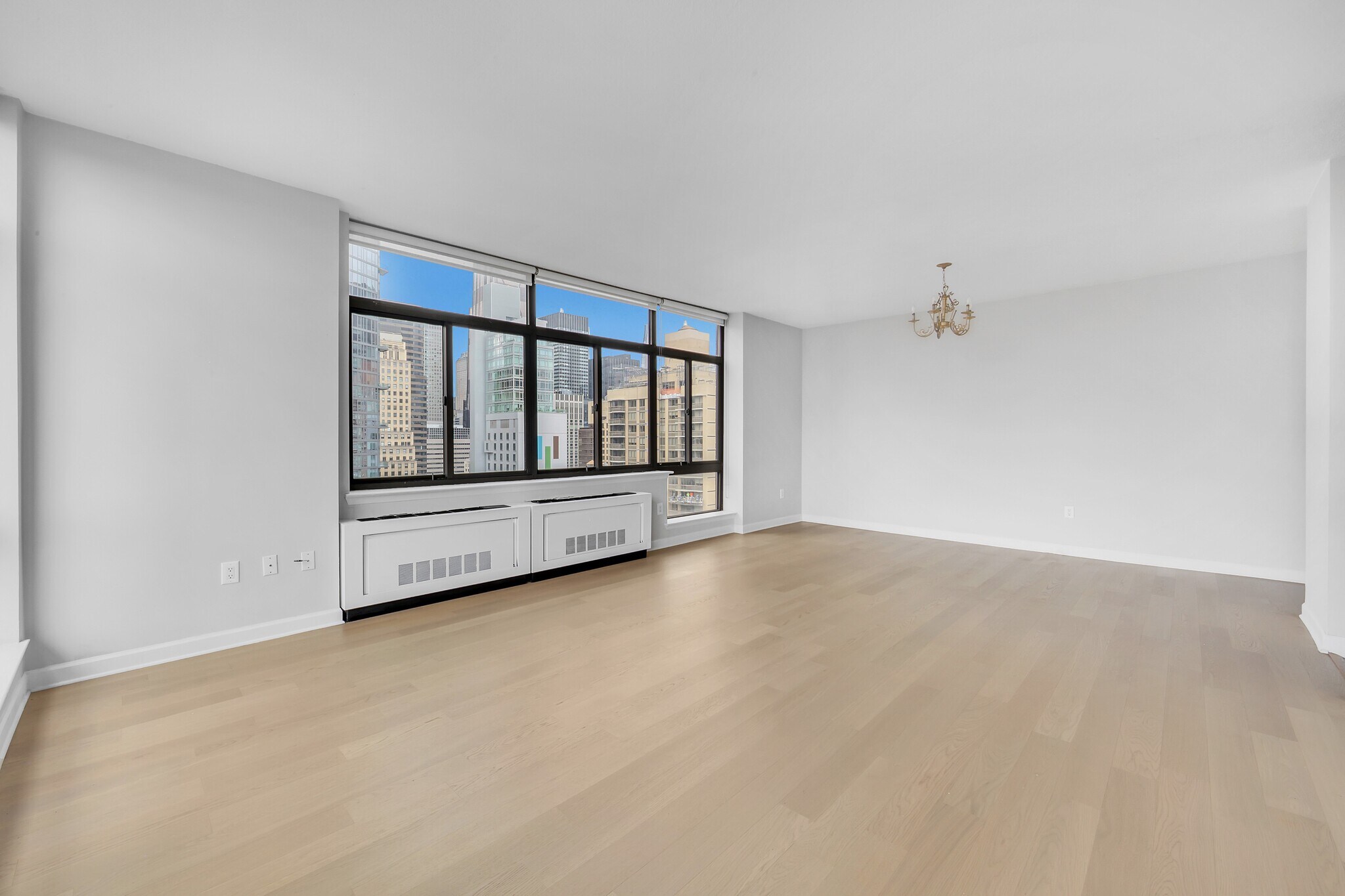 living room and a dining area - 303 E 43rd St
