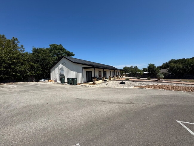 Building Photo - 2 bed 2 bath fourplex. Stained concrete floors. Washer & Dryer hookups in unit.