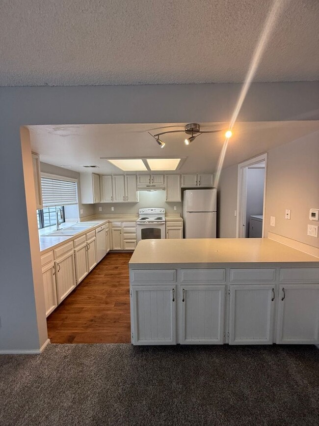 Building Photo - SPACIOUS 2-BEDROOM TOWNHOME WITH LOFT, GARAGE & PRIME LOCATION!