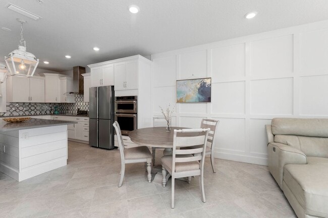 Building Photo - Introducing a captivating 3-story townhome...