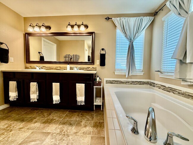 Building Photo - Spacious & Stylish 5-Bedroom Home in Wolf ...