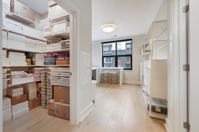 Second bedroom with closet organization system from The Container Store that is freely adaptable - 701 Swann Ave