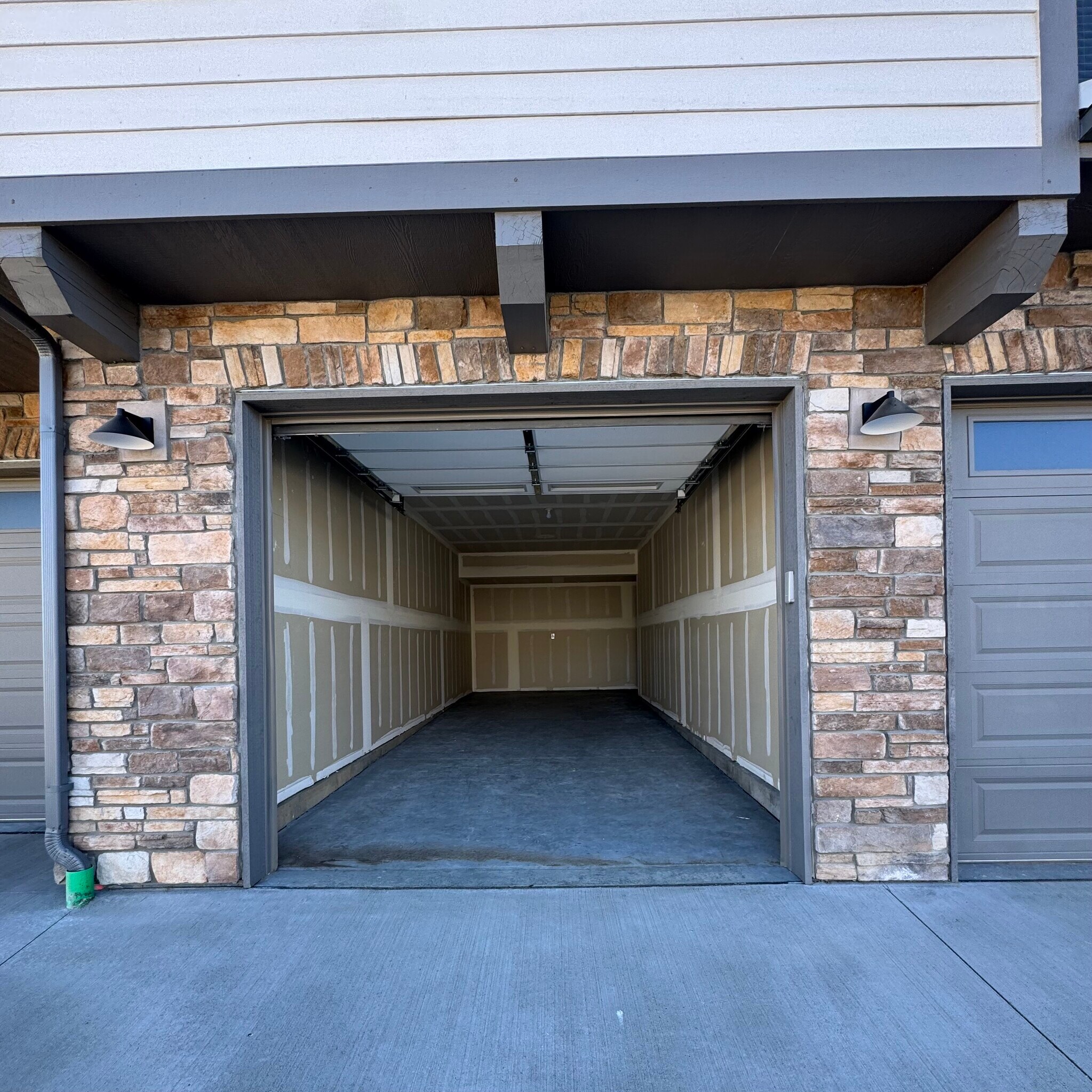 Garage with walk through door access to inside the building to stairs or elevator - 265 High Point Dr