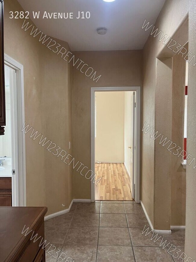 Building Photo - 3282 W Ave J 10
