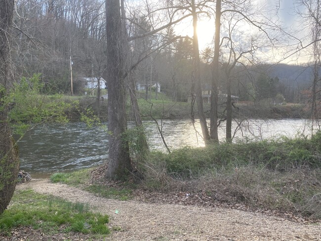 Riverside access by path from lower parking lot. - Campus Apartments East