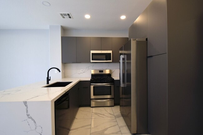 Building Photo - Charming Mediterranean-Style Townhome in G...