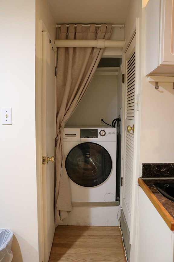 Washer/dryer combinaton. Bathroom door on L, utility room on R - 3118 Dumbarton St NW