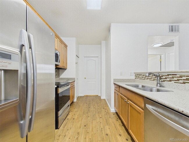 Building Photo - 10239 W 55th Dr