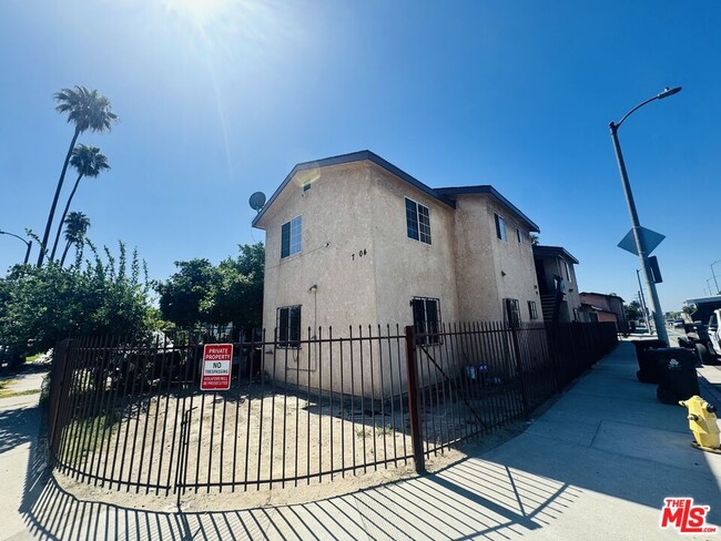 Building Photo - 7706-7706 S Grand Ave