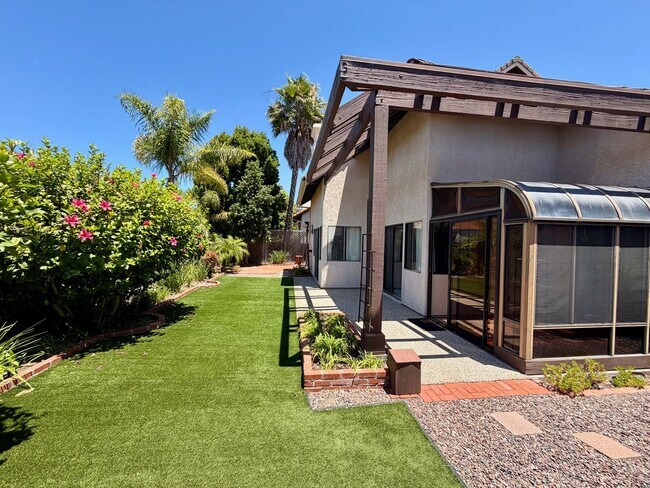 Building Photo - Private Oasis with Sunroom, Balcony & Lush Landscaping | 4BR Home Near Community Pool & Spa