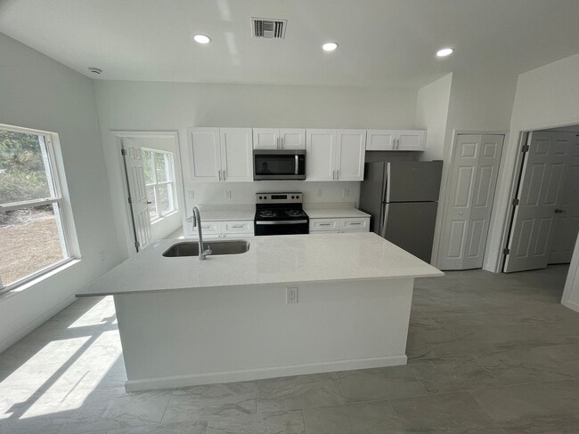 Building Photo - BRAND NEW MODERN SF HOME 3BD+den/2BA with GARAGE IN LEHIGH ACRES!