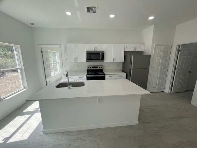 Building Photo - MODERN BRAND NEW RETREAT IN LEHIGH ACRES!