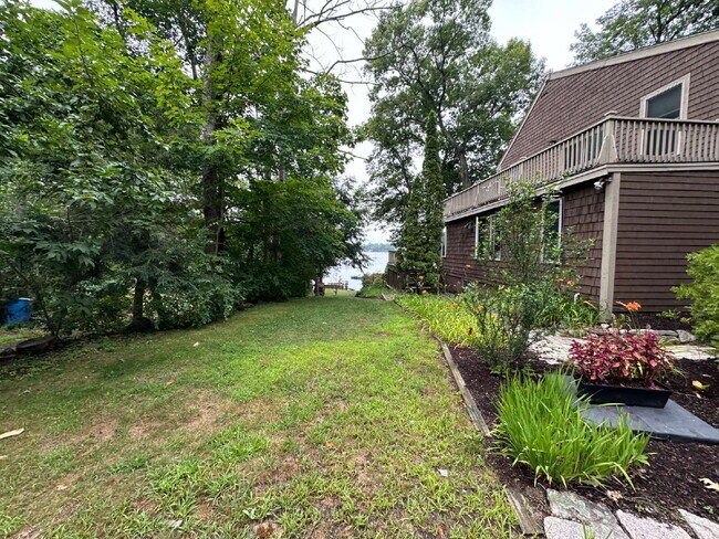 Building Photo - Peaceful Waterfront Living: 2-Story Home on River Road with Ample Outdoor Storage & Water Extras!