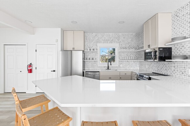 Building Photo - Newly Renovated Beach Front Four Bedroom Home