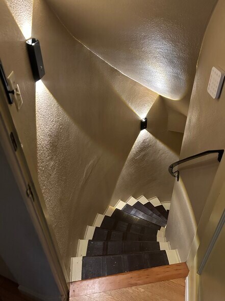 Stairwell to unit with accent lighting - 3846 NE Maywood Pl