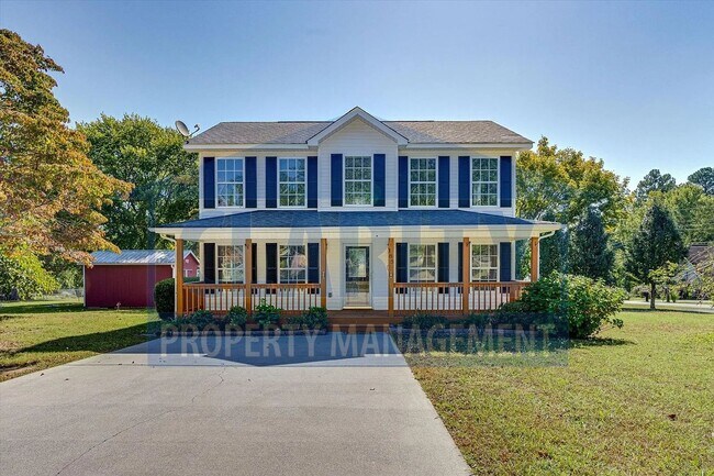 Building Photo - Updated house with carport and shed on corner lot!