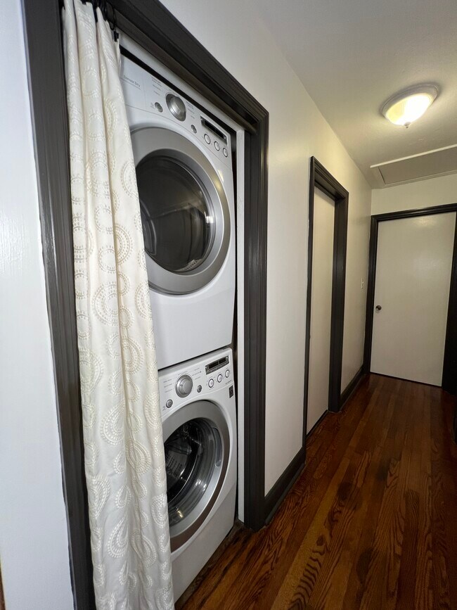 Stacked washer-dryer combo (LG) fits neatly in this nook. - 73 Swannanoa Ave