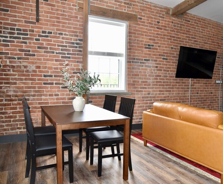 Amply lighting and seating space. All windows have room darkening shades. - 101 W Broadway St