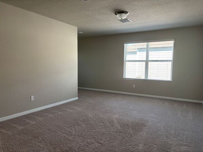 Building Photo - Like-New 4 Bedroom 3 Bath with Pond View & Two Living Spaces — Minutes to South Lake Nona