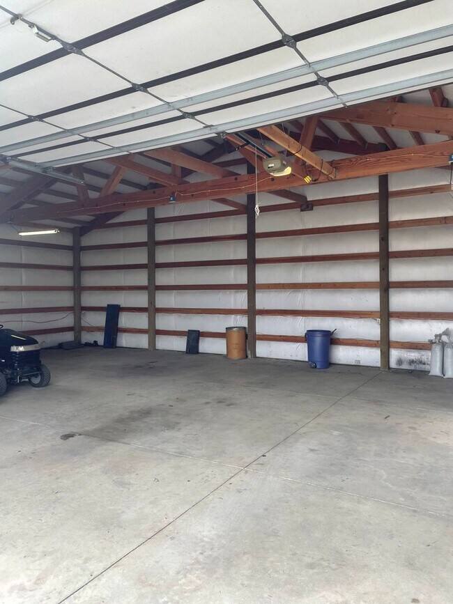 Building Photo - Charming Log Home For Rent with Large Shop & Spacious Yard
