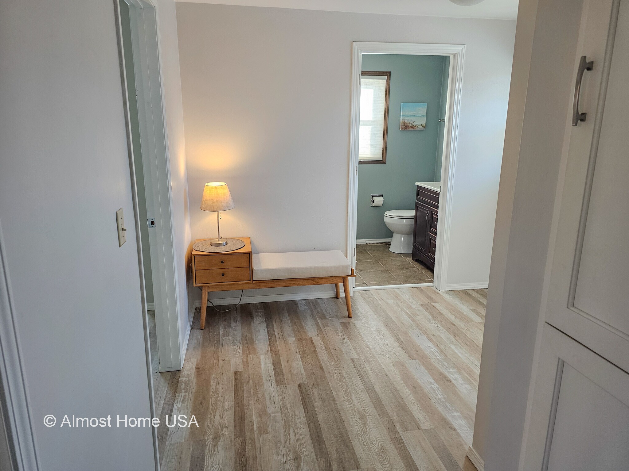 Hallway with Plank Flooring - 1028 Coppens Rd