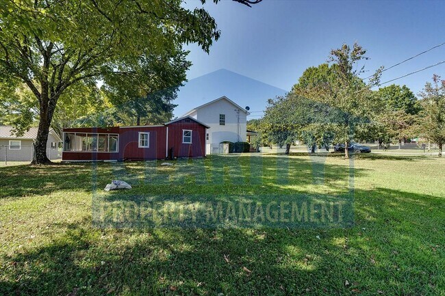 Building Photo - Updated house with carport and shed on corner lot!