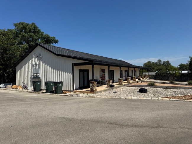 Building Photo - 2 bed 2 bath fourplex. Stained concrete floors. Washer & Dryer hookups in unit.