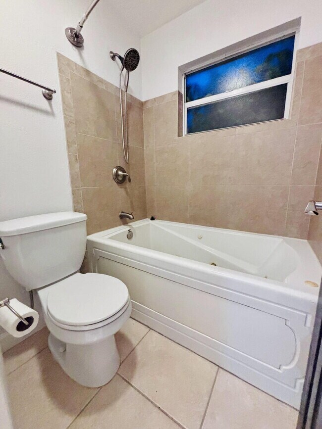 Building Photo - Coastal 4-Bedroom Oasis – Walk to the Beach!