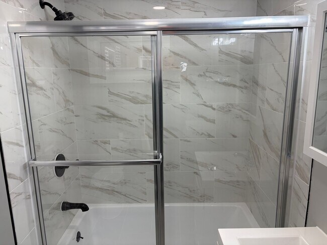 Building Photo - Newly Renovated 2- Story Townhome with Front Porch and Back Yard