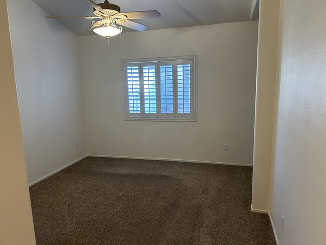 master bedroom with walk in closed and bath with a double vanity - 33519 Winston Way