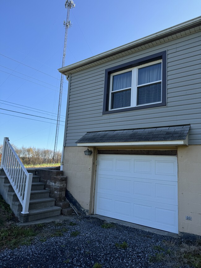 One car garage, steps leading up to the front porch (great for entertaining entrance) - 620 Horn Rd