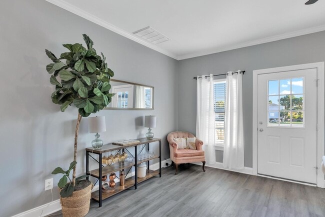 Building Photo - Updated coastal townhome- fully furnished!