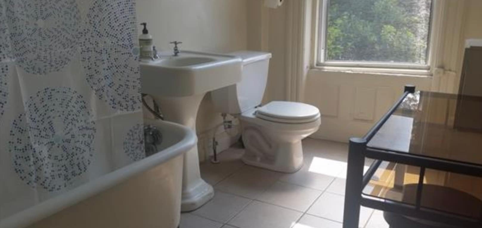 Original cast iron sink and clawfoot tub with shower head - 198 Hancock St