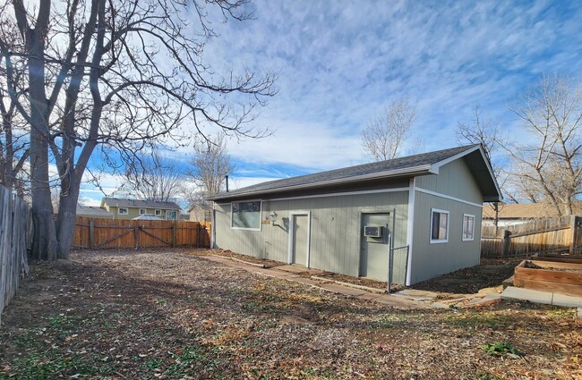 Building Photo - Shop-Ready 4BR Home with Lift-Ready Detached Garage & RV Parking Near Downtown Firestone