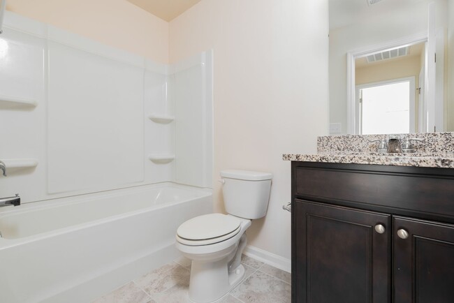 Building Photo - End unit townhome loaded with upgrades close to RTP! Available: Now