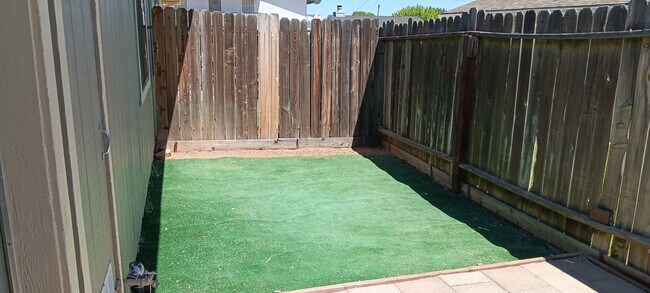 Low maintenance fenced yard area - 21230 Madre St