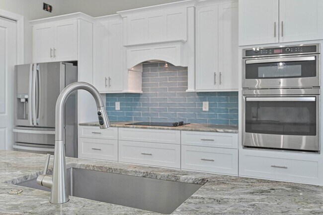 Building Photo - NOW AVAILABLE - Gorgeous Pool Home ~ NW Cape ~ 3 Car Garage ~ On Canal!