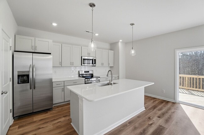 Building Photo - 4BR Home in The Pines at Paw Creek – New Construction + Private Deck