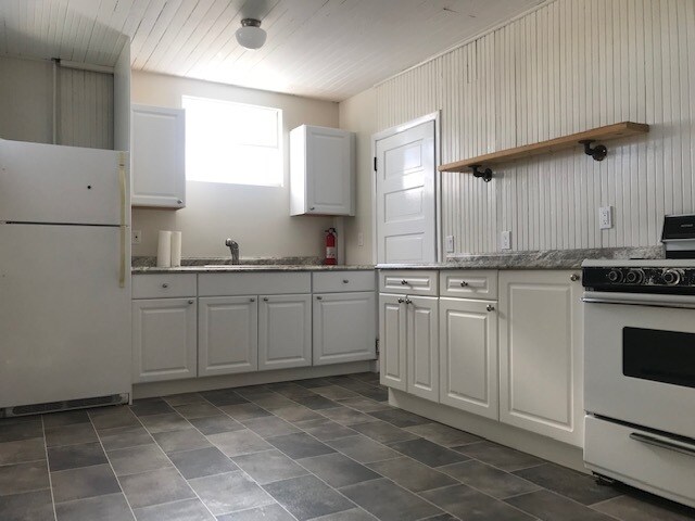 Kitchen showing door into bathroom - 1303 44th Ave SW