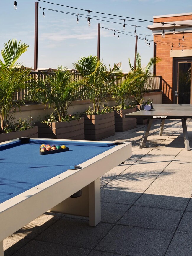 Play a round of billiards on the rooftop terrace. - The Metropolitan at 40 Park