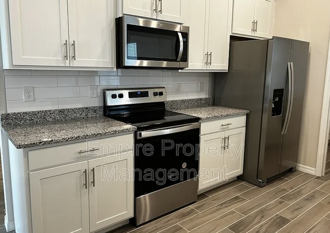 Building Photo - 4 Bedroom 2 bathroom 3 Car Garage NE Cape ...
