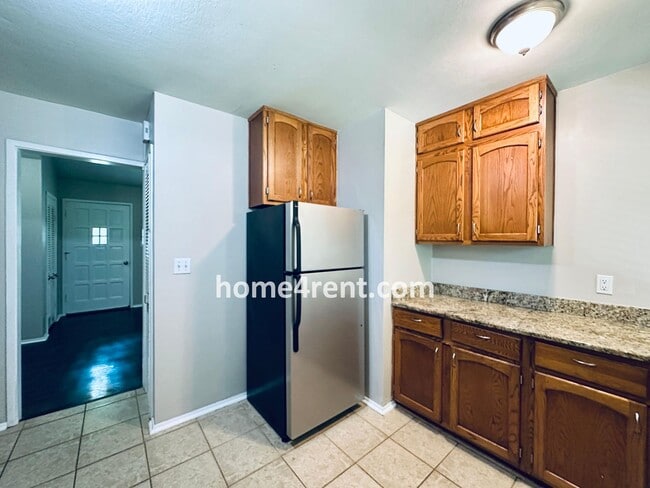 Building Photo - Attractive Prairie Village Ranch w/ FRESH PAINT, Wood Floors, Granite Counters and a Fenced Yard!