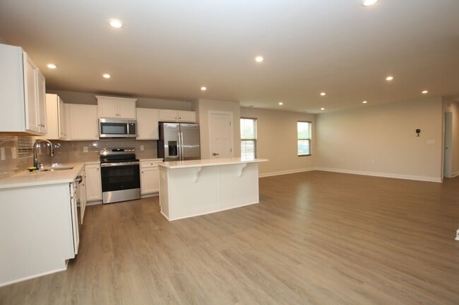 Building Photo - Maintenance Free Living in this Brand New ...